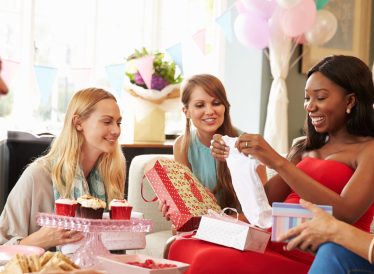 Group Of Female Friends Meeting For Baby Shower At Home